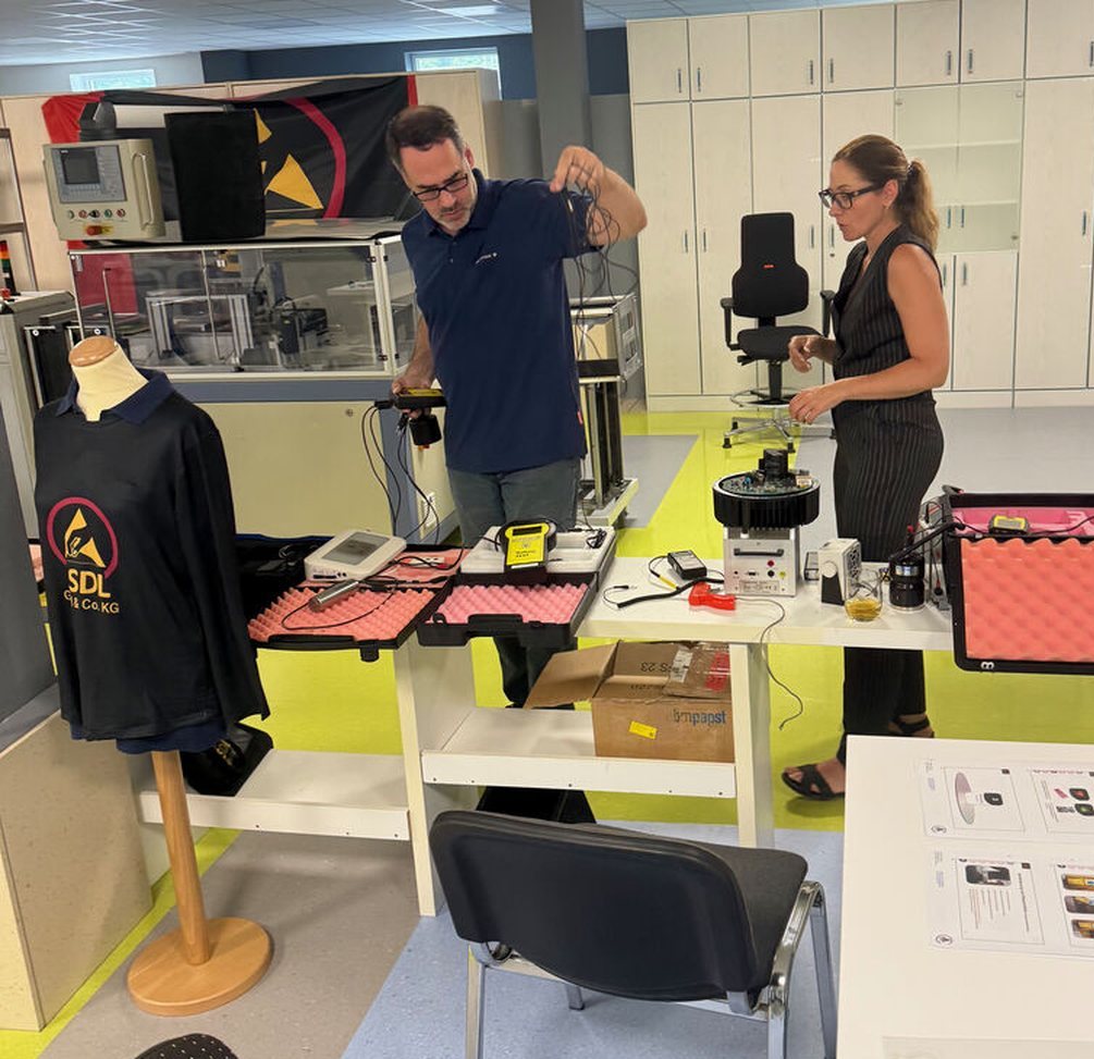 Michael Zwicknagl and Adrianna Szewczyk working with ESD measurement equipment in the ESDL training lab